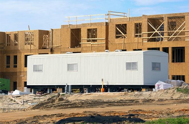 construction workers discussing plans in a rental office in Indian Harbour Beach